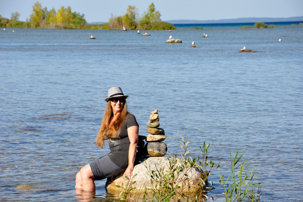 Karen Duquette relaxes at Grand Traverse Bay